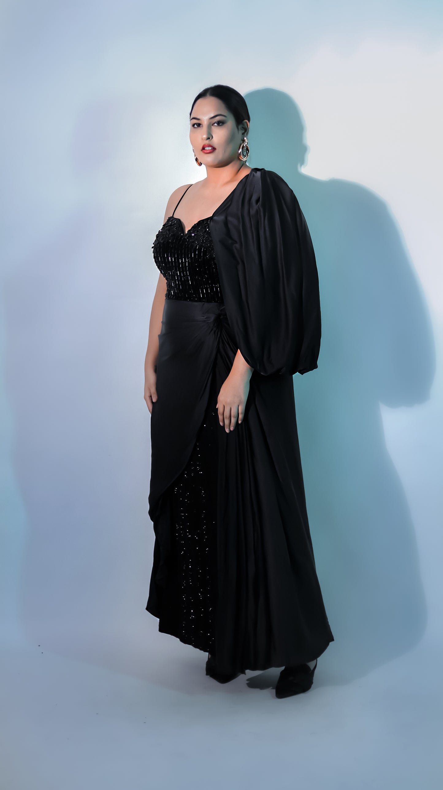 SAKSHI SINDHWANI IN CYRSTAL NOIR CAPE GOWN