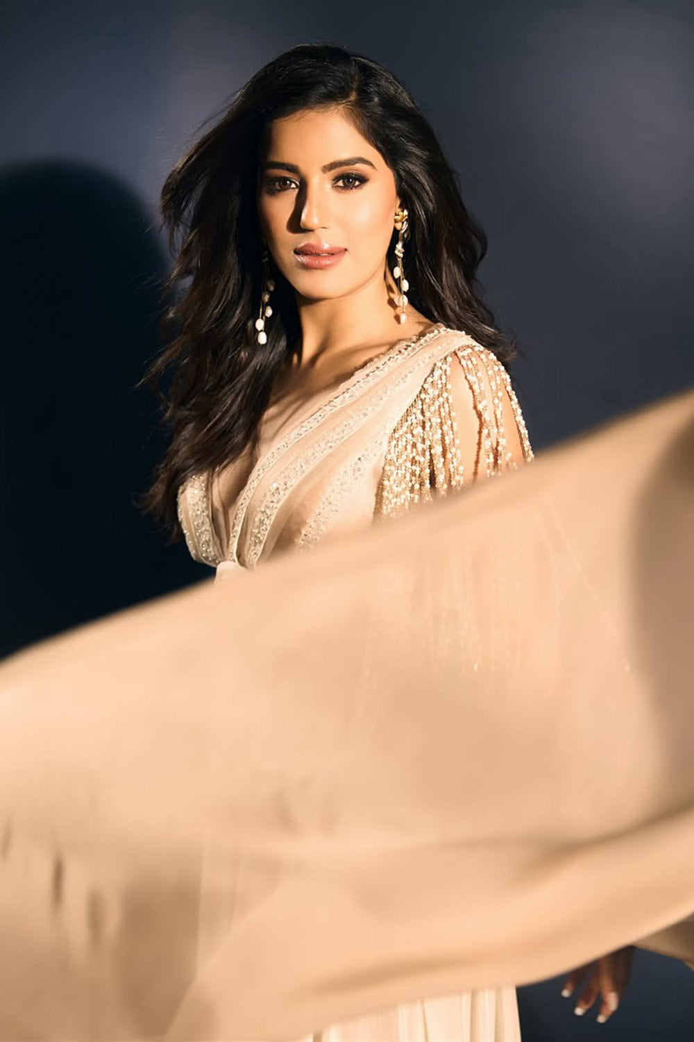 Miss Diva in Ivory and taupe maxi dress with embellished tassels