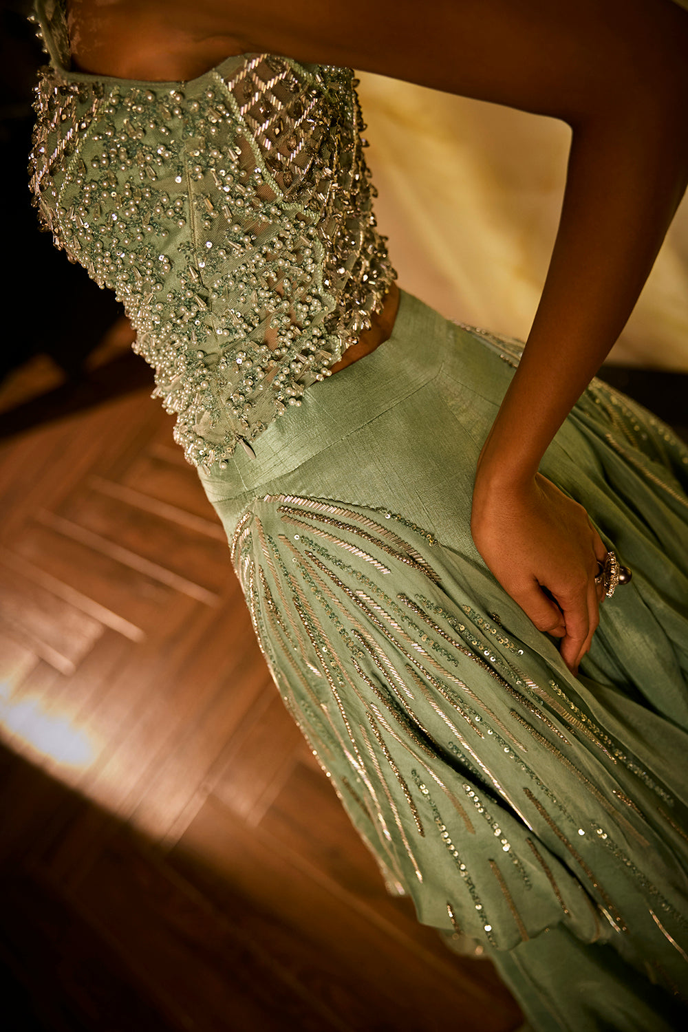 Mint green lehenga set with an embellished blouse