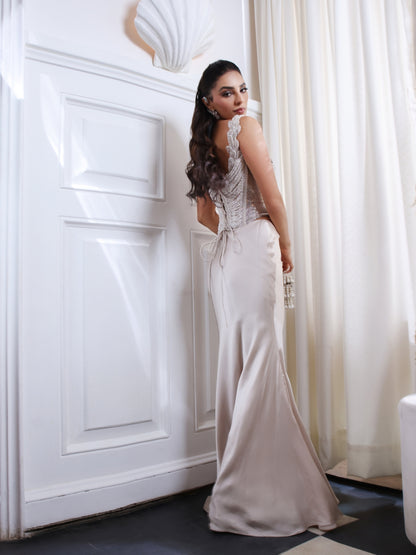 An pearl embellished corset paired with a fluid satin skirt.An pearl embellished corset paired with a fluid satin skirt.