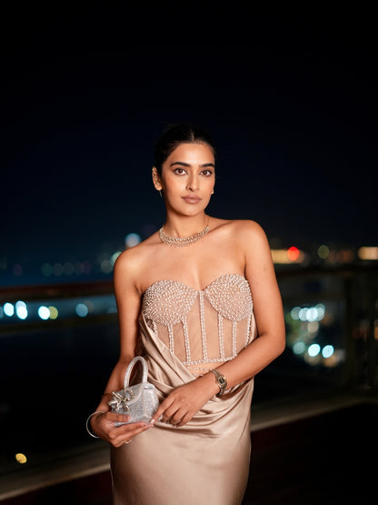 A Champagne Taupe Strapless Gown With A Pearl And Crystal Embroidered Corset Bodice And Flowing Satin Skirt.