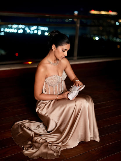 A Champagne Taupe Strapless Gown With A Pearl And Crystal Embroidered Corset Bodice And Flowing Satin Skirt.