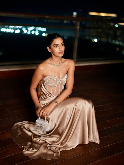 A Champagne Taupe Strapless Gown With A Pearl And Crystal Embroidered Corset Bodice And Flowing Satin Skirt.