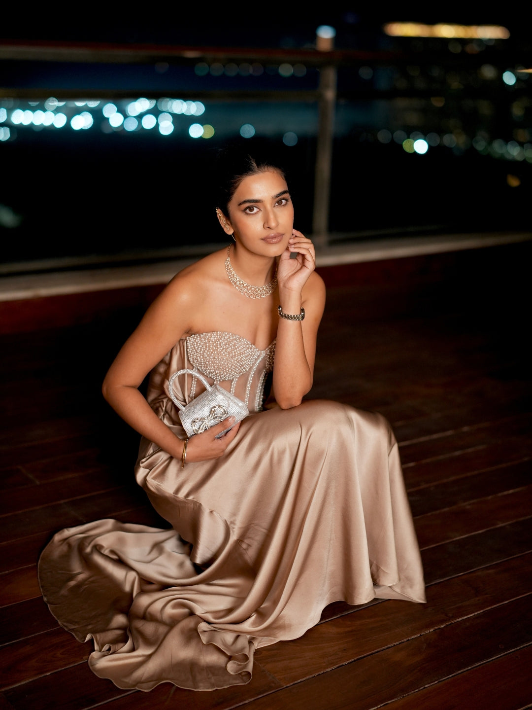 A Champagne Taupe Strapless Gown With A Pearl And Crystal Embroidered Corset Bodice And Flowing Satin Skirt.
