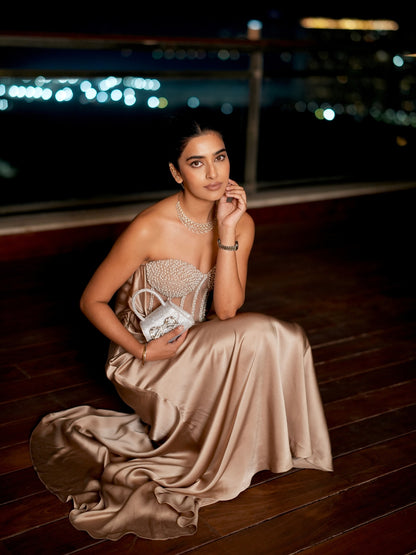 A Champagne Taupe Strapless Gown With A Pearl And Crystal Embroidered Corset Bodice And Flowing Satin Skirt.