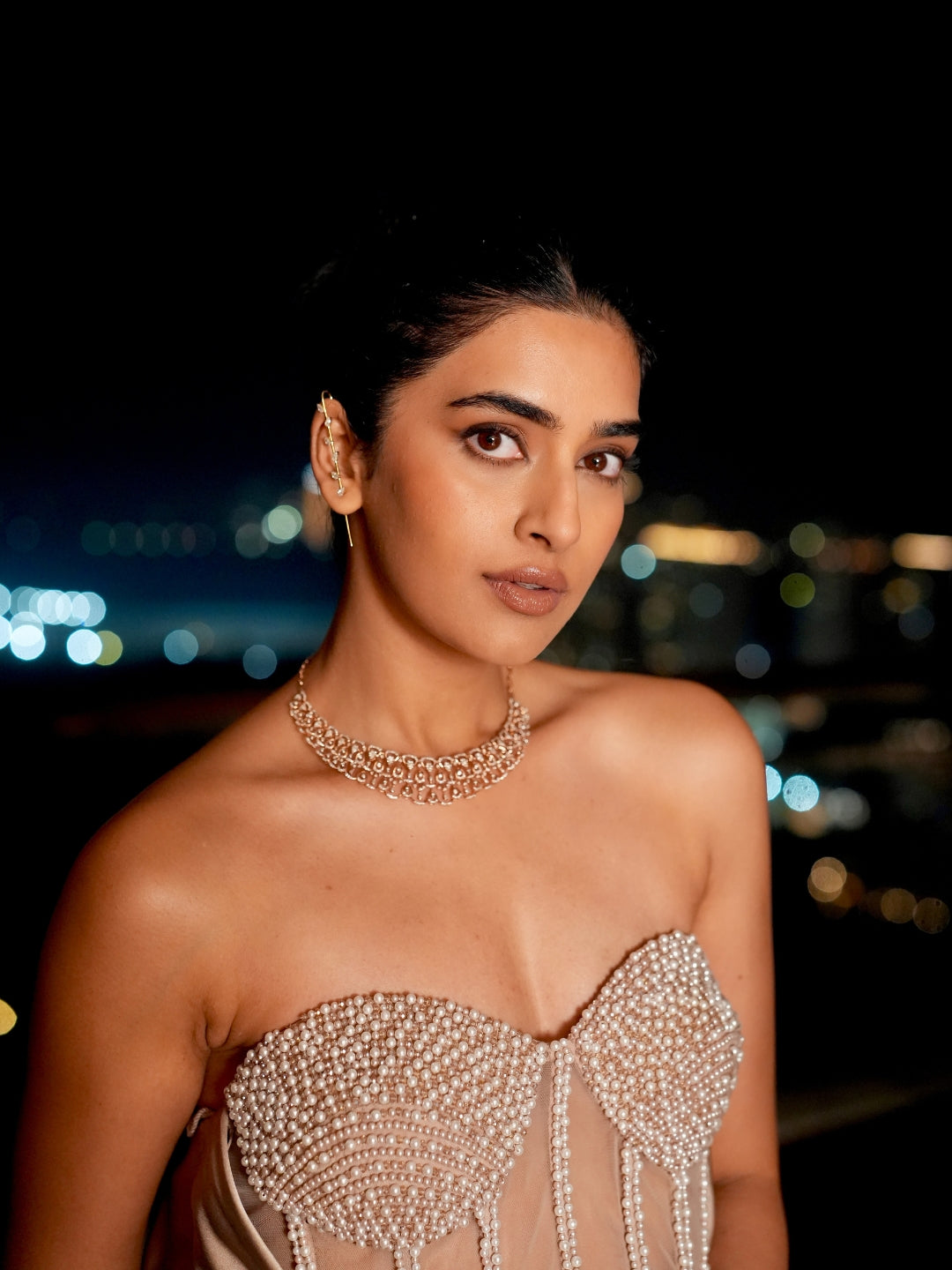 A Champagne Taupe Strapless Gown With A Pearl And Crystal Embroidered Corset Bodice And Flowing Satin Skirt.