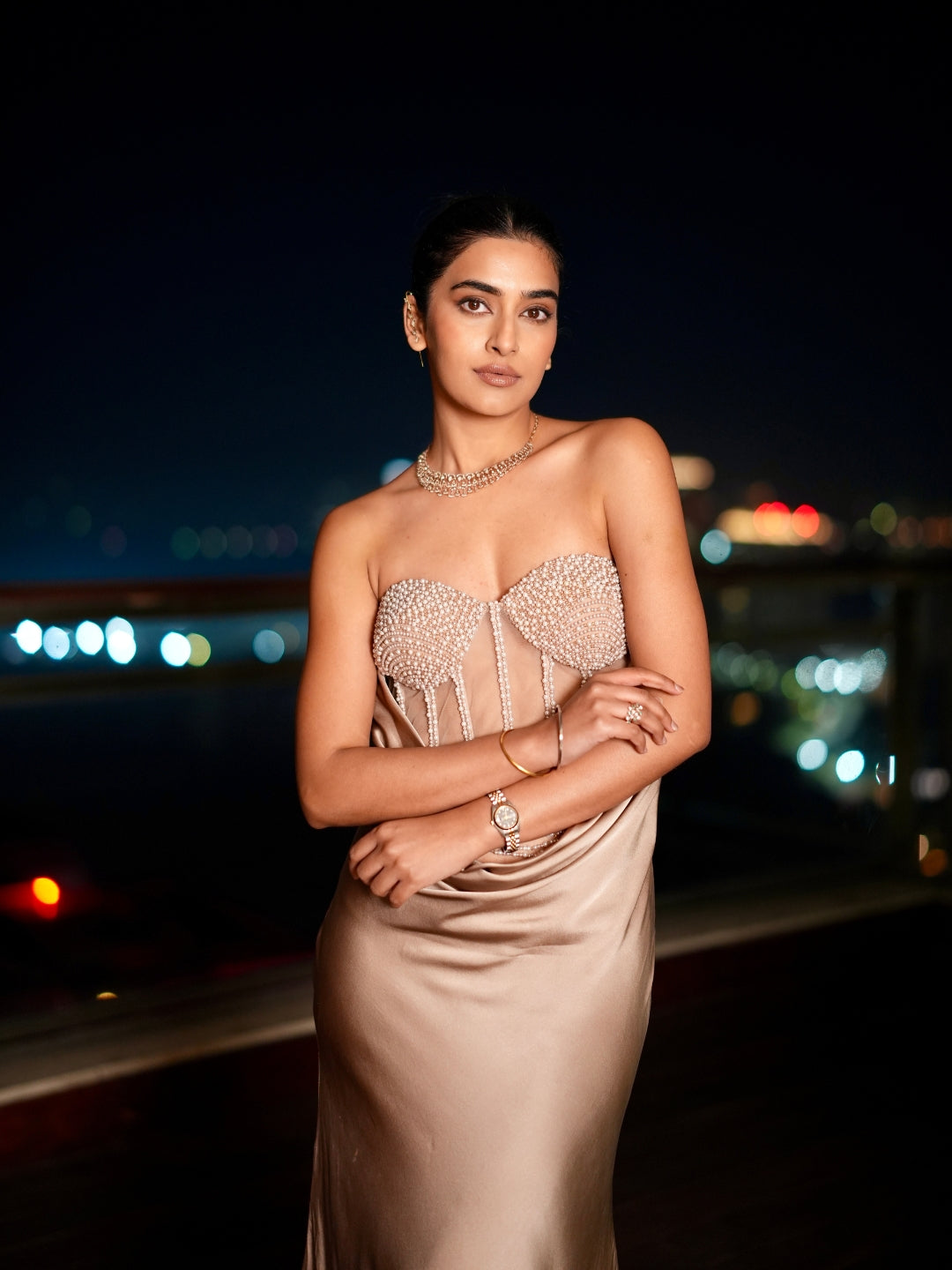 A Champagne Taupe Strapless Gown With A Pearl And Crystal Embroidered Corset Bodice And Flowing Satin Skirt.