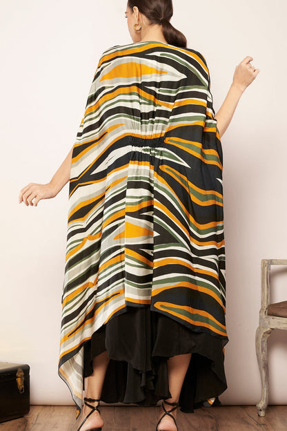 Printed cape with tucks detailing.