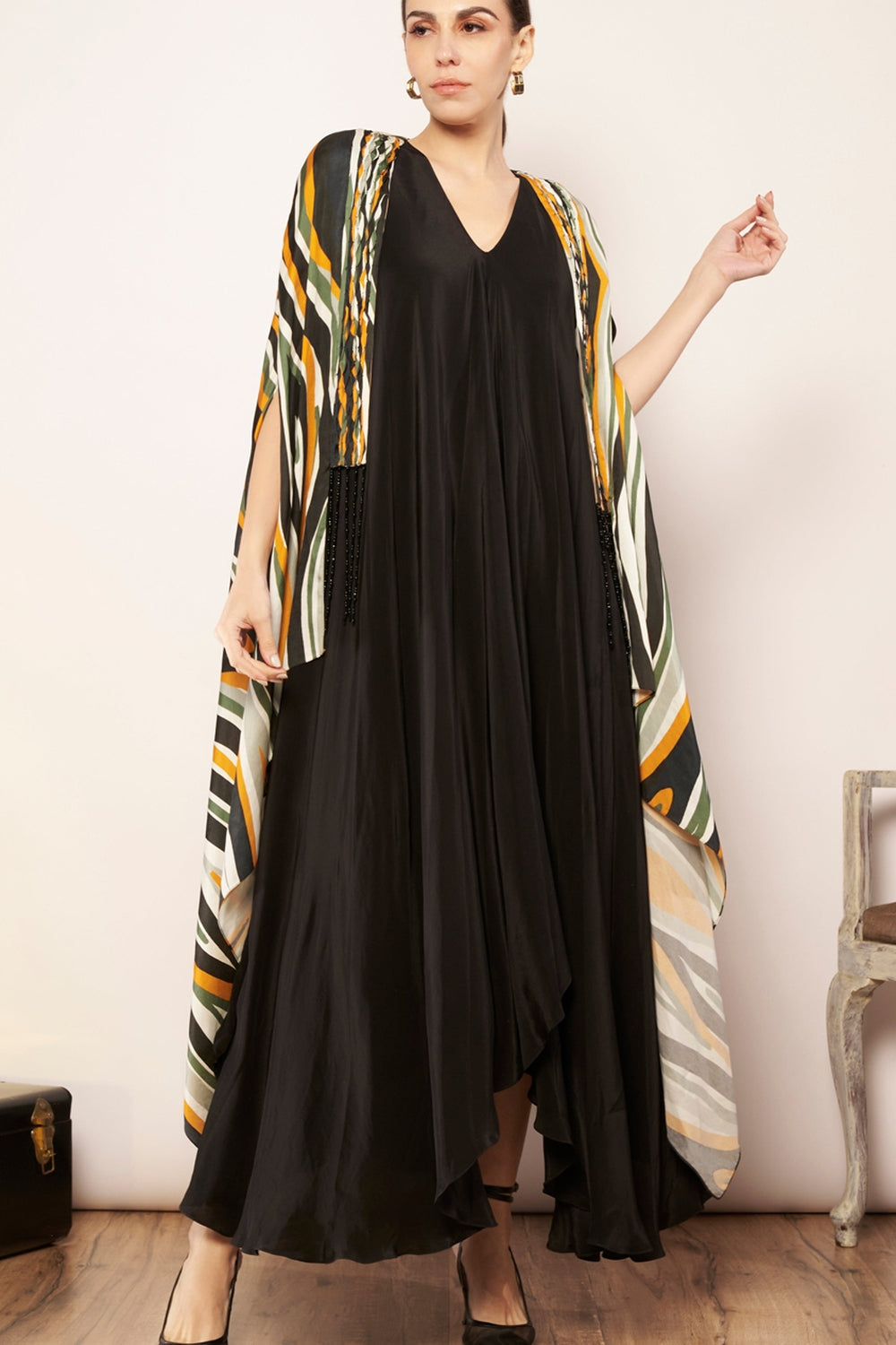 Printed cape with tucks detailing.