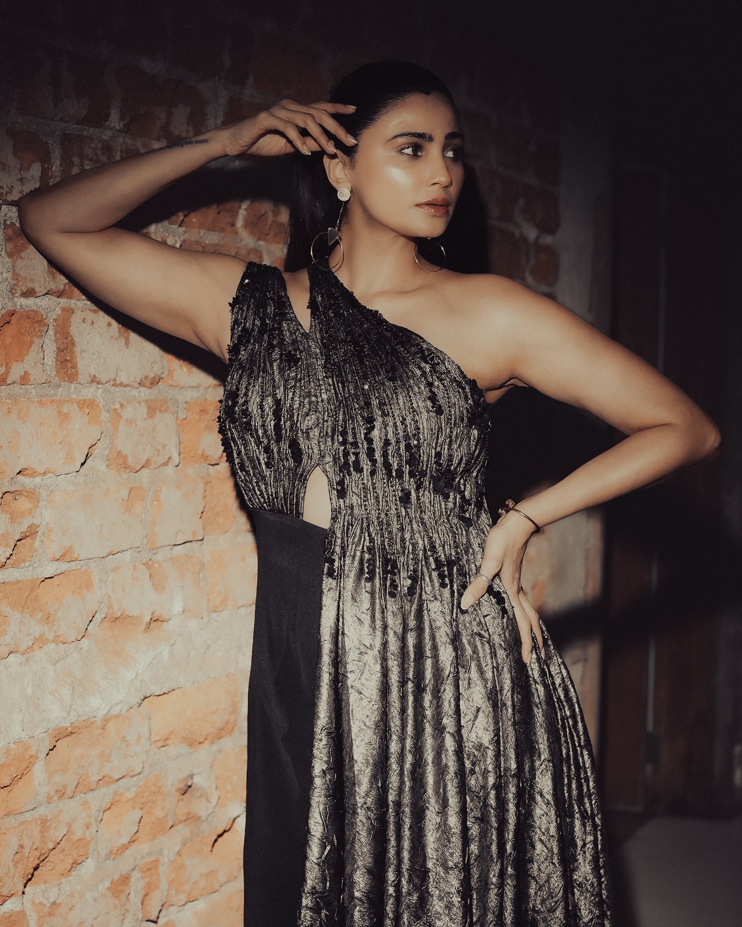 Daisy Shah in Molten Gold Drape Jumpsuit