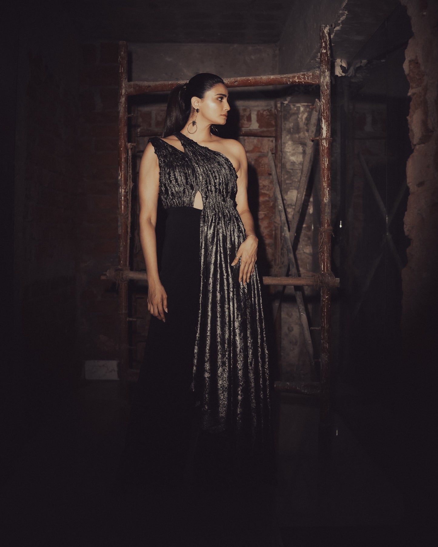 Daisy Shah in Molten Gold Drape Jumpsuit
