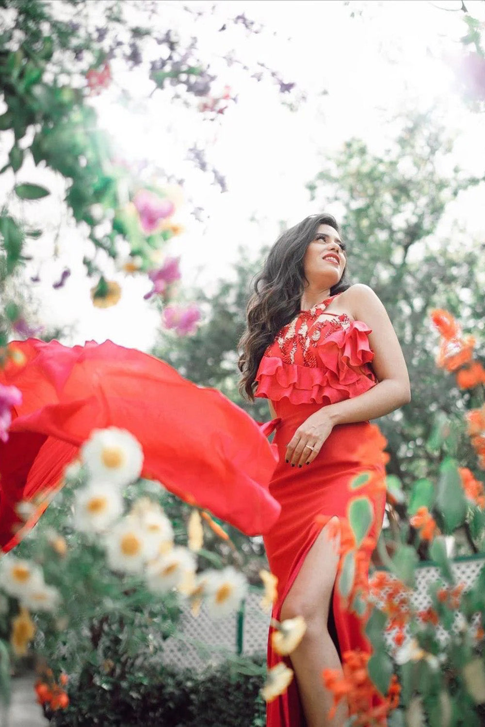 Sukhmani Gambhir and Akriti Rana in One Shoulder Scarlet Red High-Slit Ruffle Detailed Gown
