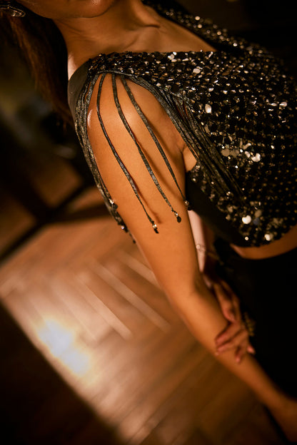 Black drape saree paired with a sequined blouse