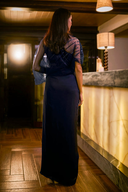 Midnight Blue jumpsuit with sheer sleeve and draped silhouette