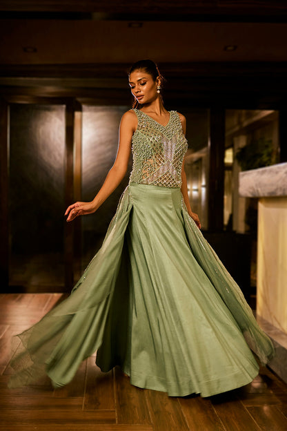 Mint green lehenga set with an embellished blouse