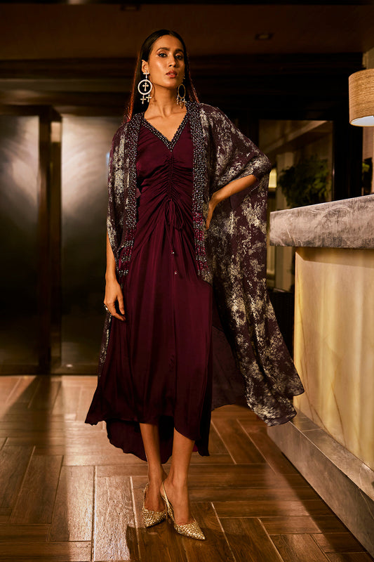 Ruched knot dress with a gold crushed foil cape