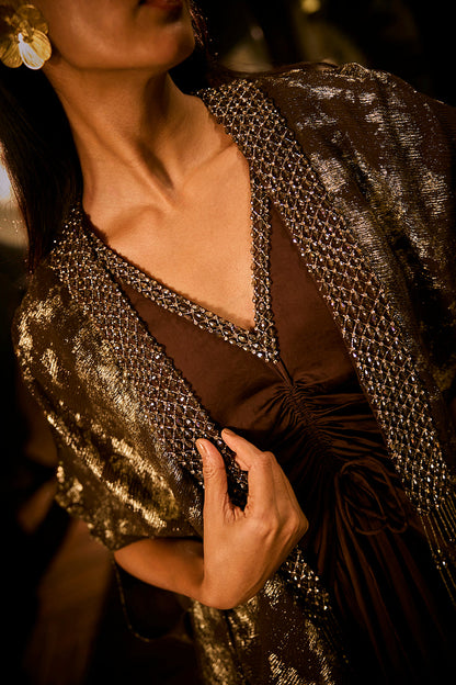 Ruched knot dress with a gold crushed foil cape